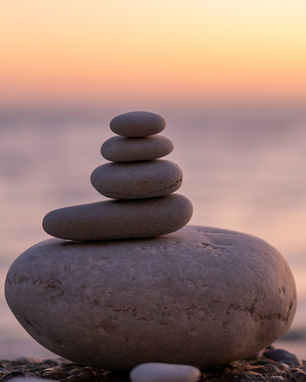 Stack of cairns representing mindfulness with Paige Simpson-Hamilton, PsyD, Lexington, MA Psychologist